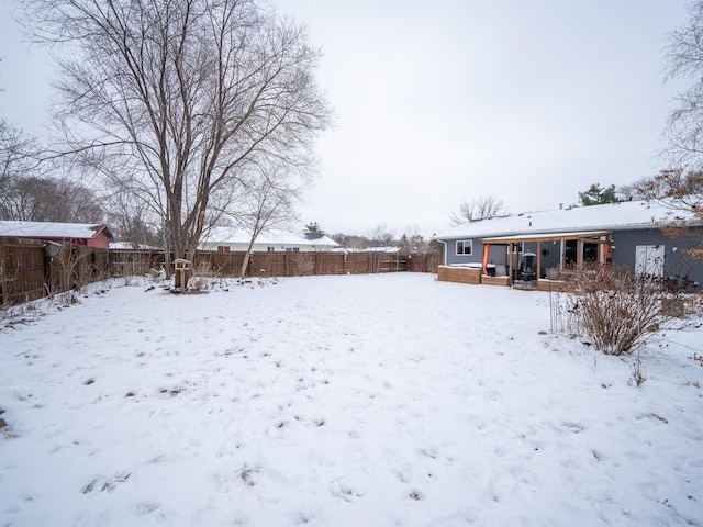 view of yard covered in snow