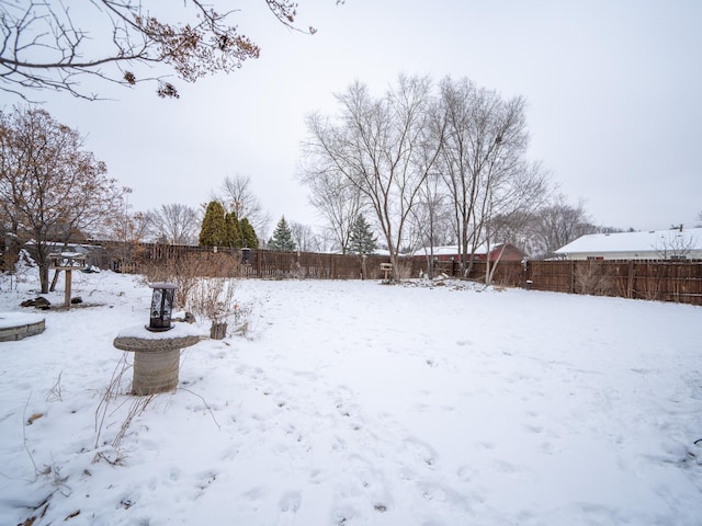 view of yard covered in snow