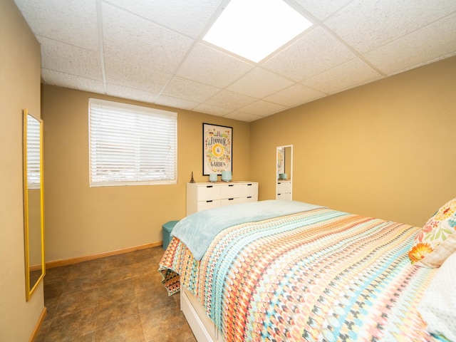 bedroom with a paneled ceiling