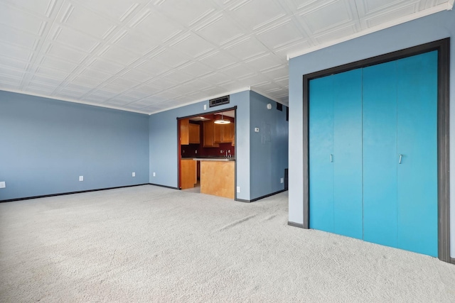 unfurnished living room featuring carpet floors