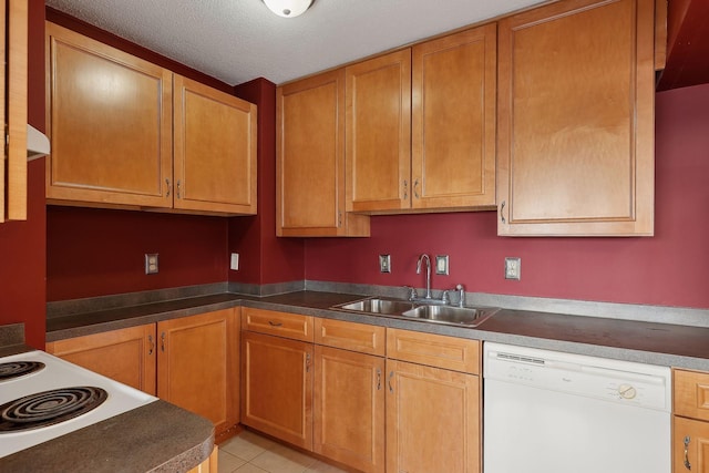 kitchen featuring sink, a textured ceiling, light tile patterned floors, and dishwasher