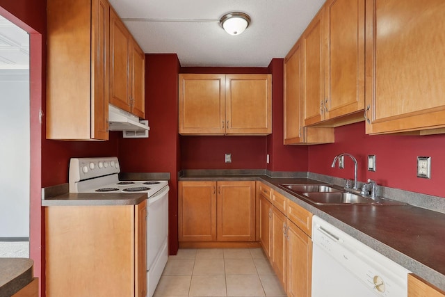 kitchen with a textured ceiling, light tile patterned flooring, sink, and white appliances