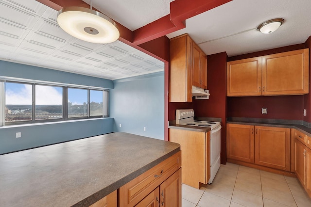 kitchen featuring electric range and light tile patterned floors