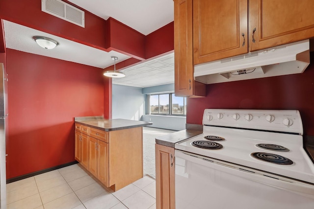 kitchen featuring pendant lighting, kitchen peninsula, electric range, stainless steel refrigerator, and light tile patterned floors