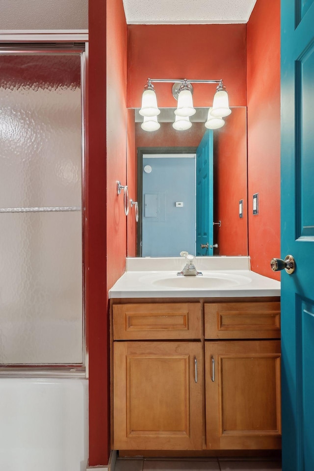 bathroom with a textured ceiling and vanity