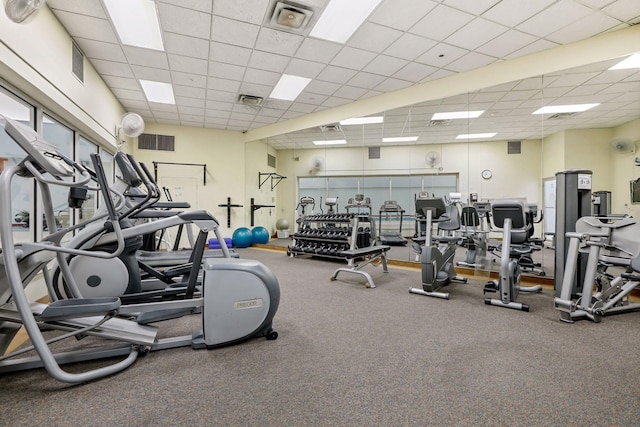 workout area featuring a paneled ceiling