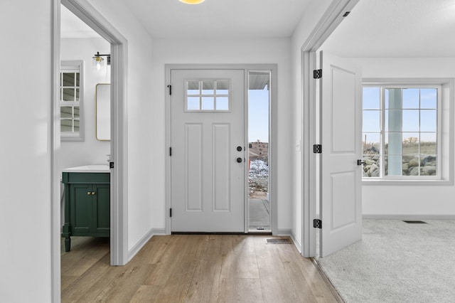 foyer featuring light hardwood / wood-style floors