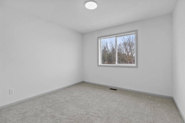 spare room with carpet flooring