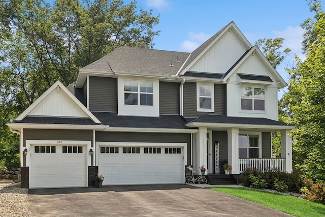 craftsman-style home with a garage and covered porch