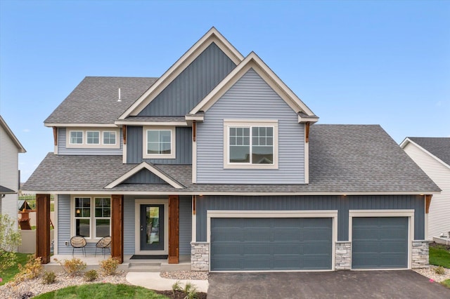 craftsman house featuring a porch and a garage