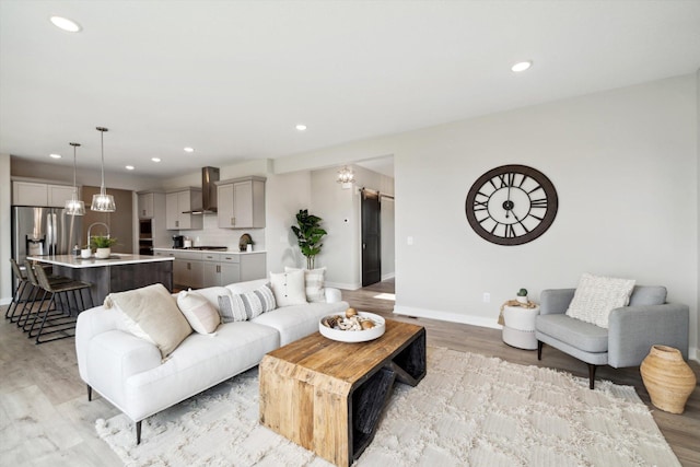 living room featuring light hardwood / wood-style floors and sink