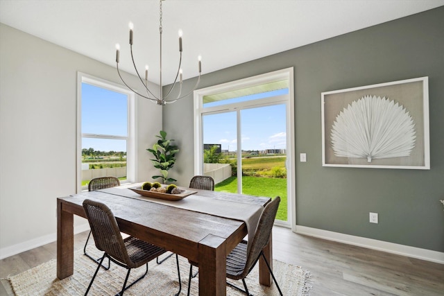 dining space featuring a chandelier and hardwood / wood-style flooring