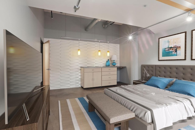 bedroom featuring concrete flooring and rail lighting