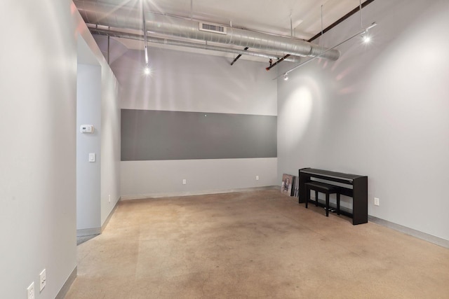 basement with visible vents and baseboards