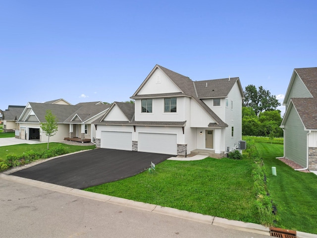 view of front of property with a garage and a front lawn