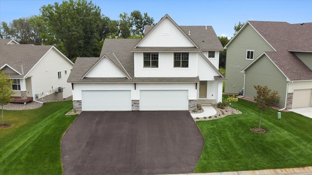 view of front of house featuring a garage and a front yard