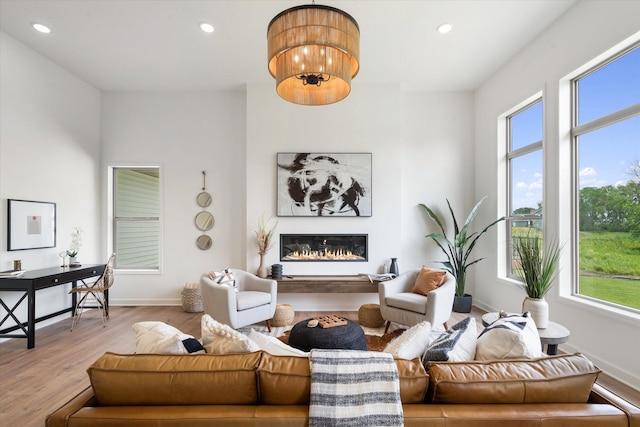 living room featuring hardwood / wood-style flooring and a notable chandelier