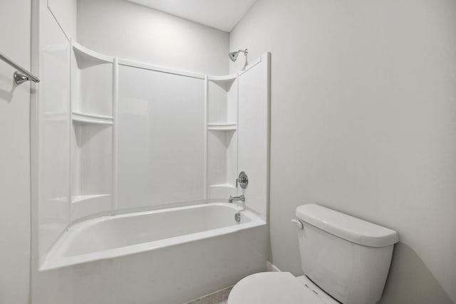 bathroom featuring shower / washtub combination and toilet