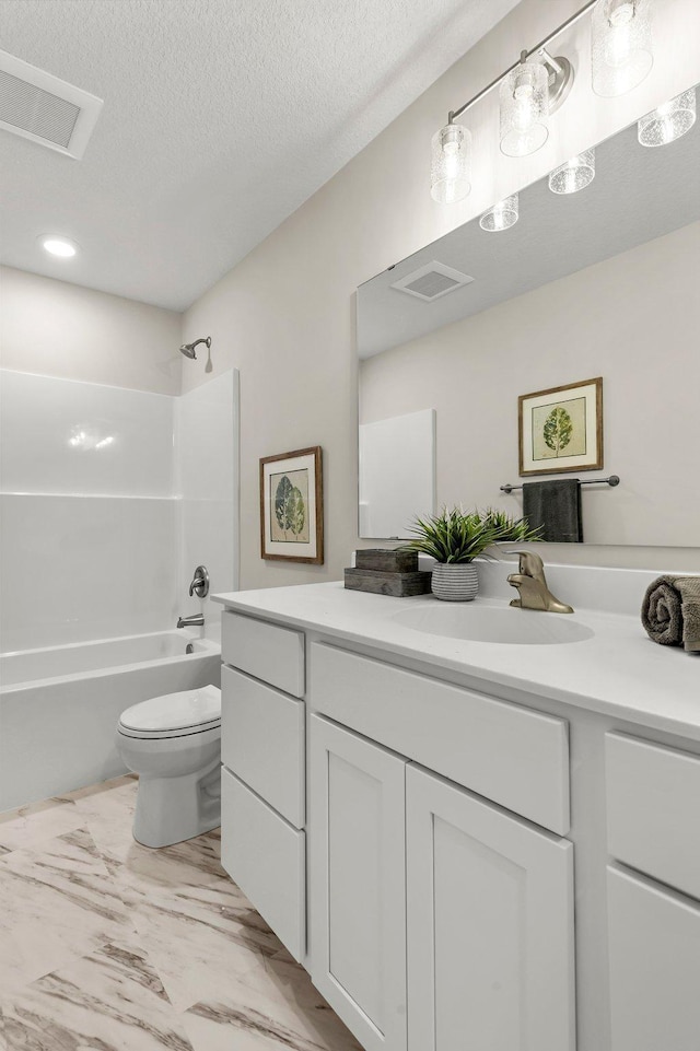 bathroom with visible vents, marble finish floor, washtub / shower combination, and toilet