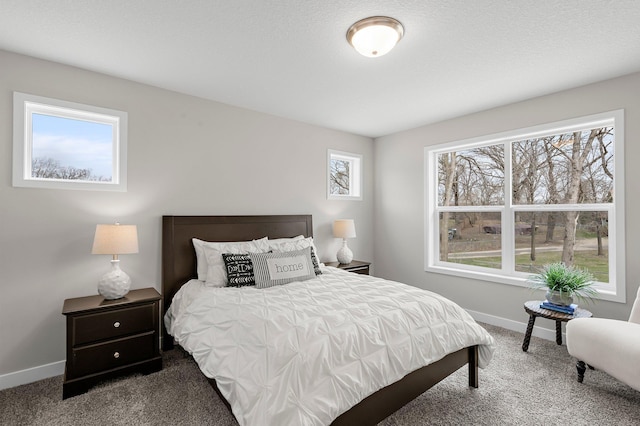 bedroom featuring carpet flooring and baseboards