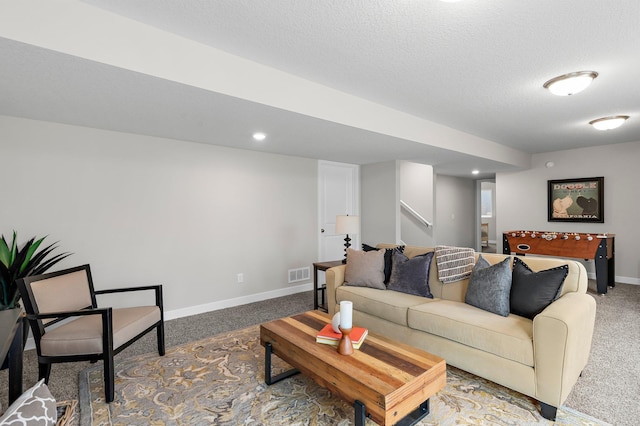 living room with stairway, visible vents, baseboards, a textured ceiling, and carpet flooring