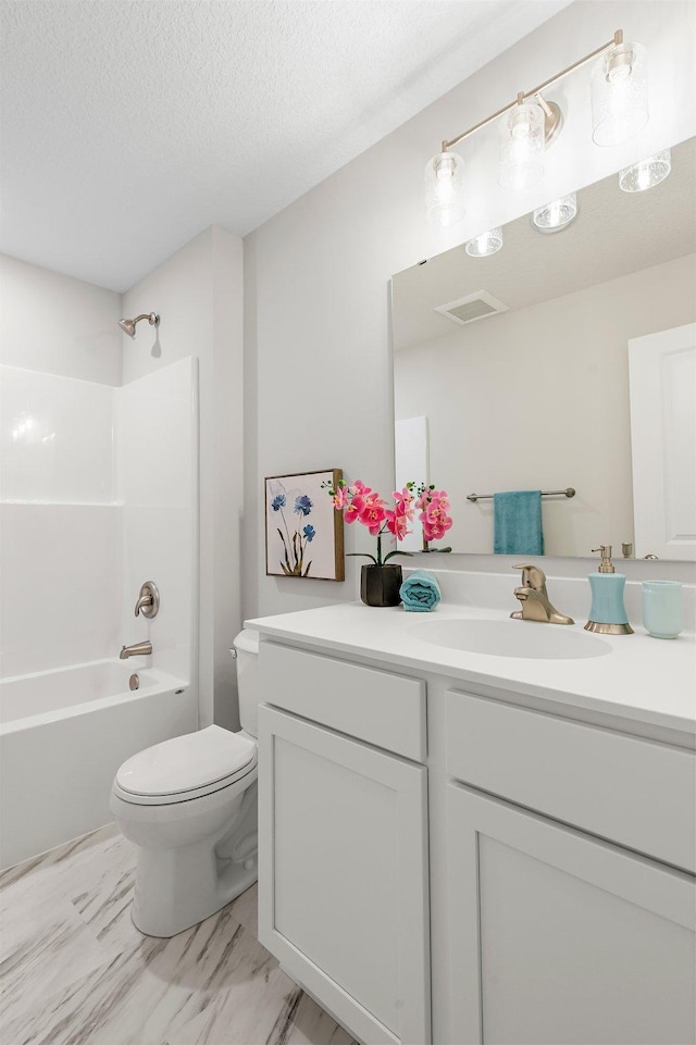 full bathroom with a textured ceiling, vanity, washtub / shower combination, toilet, and visible vents