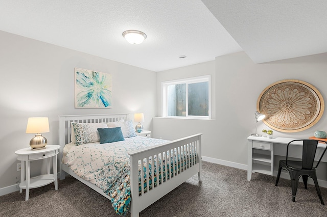 bedroom with baseboards, carpet flooring, and a textured ceiling