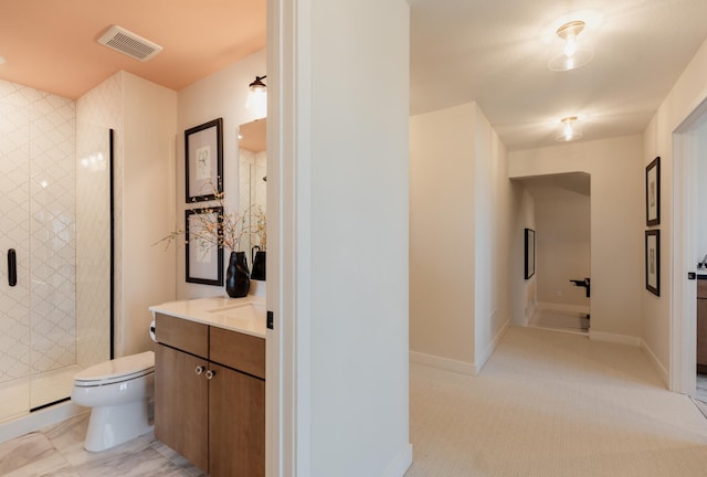 bathroom with vanity, toilet, and walk in shower