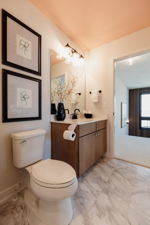 bathroom with vanity and toilet