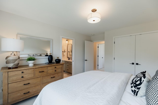 bedroom featuring ensuite bathroom and a closet