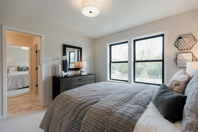 bedroom with light carpet