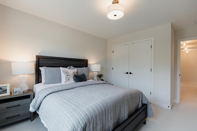 carpeted bedroom with a closet