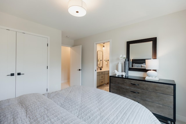 bedroom featuring connected bathroom and a closet