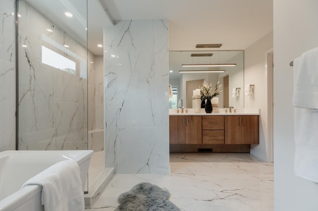 bathroom featuring a tile shower and vanity