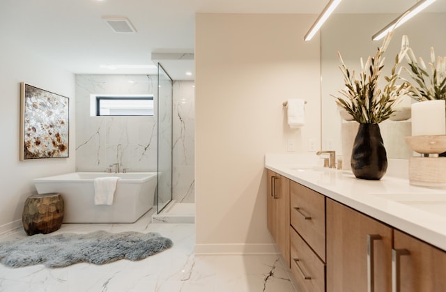 bathroom with vanity and independent shower and bath