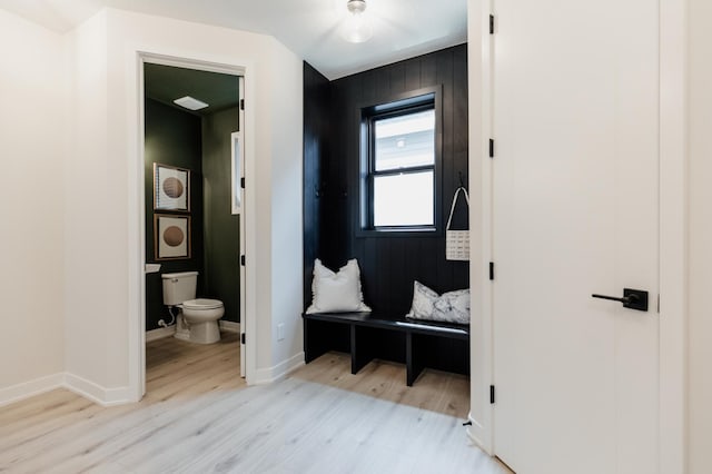 bathroom featuring hardwood / wood-style floors and toilet