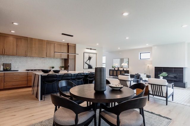 dining area featuring light hardwood / wood-style flooring and sink