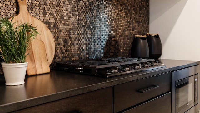 kitchen featuring appliances with stainless steel finishes and tasteful backsplash