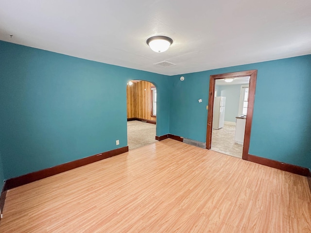 spare room featuring light hardwood / wood-style flooring