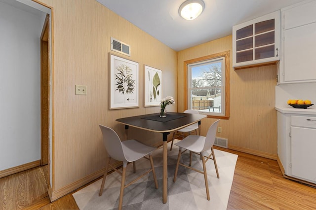 dining room with light hardwood / wood-style floors