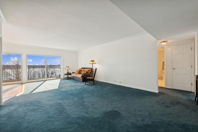 unfurnished room featuring dark carpet and crown molding