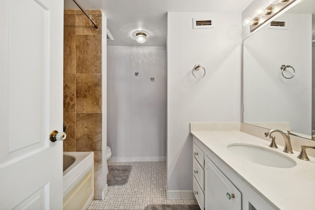 full bathroom featuring tile patterned flooring, vanity, toilet, and tiled shower / bath combo