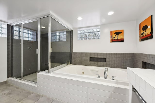 bathroom with shower with separate bathtub, plenty of natural light, and tile patterned floors