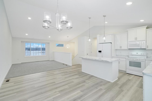 kitchen with white appliances, hanging light fixtures, white cabinets, and a center island