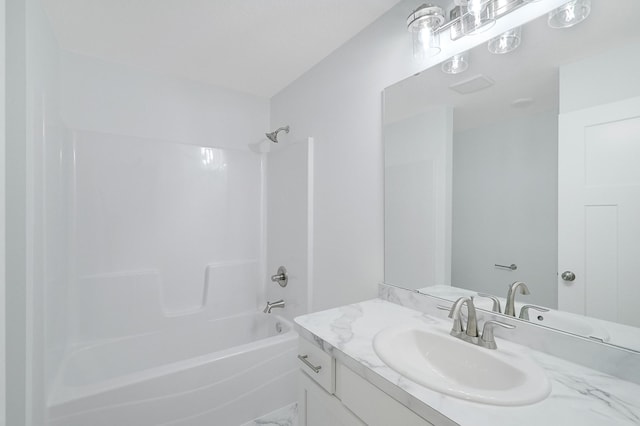 bathroom featuring bathtub / shower combination and vanity