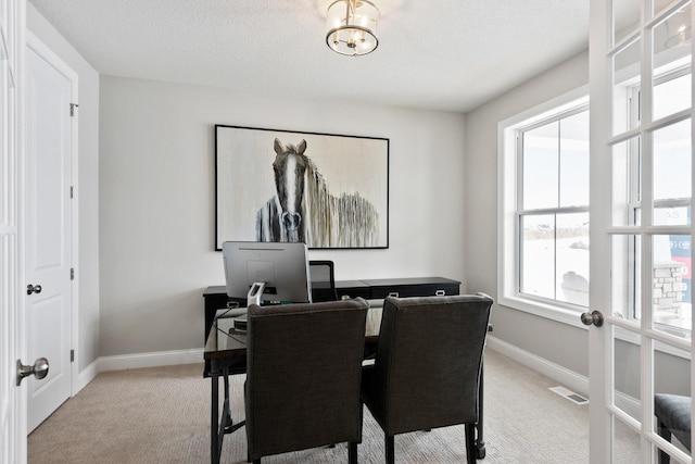 carpeted dining space featuring an inviting chandelier