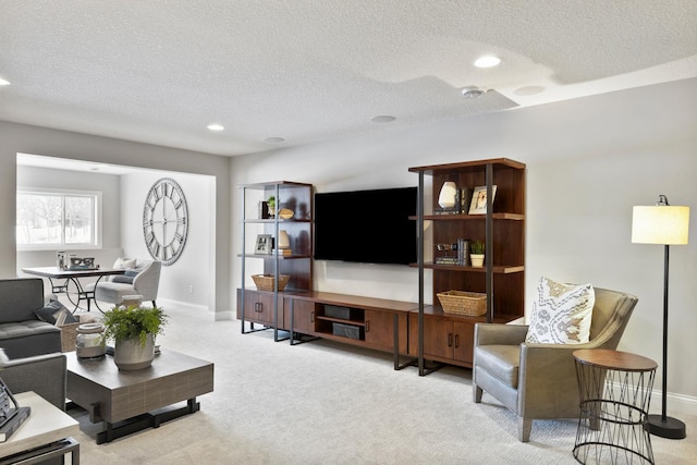 living room with light carpet and a textured ceiling