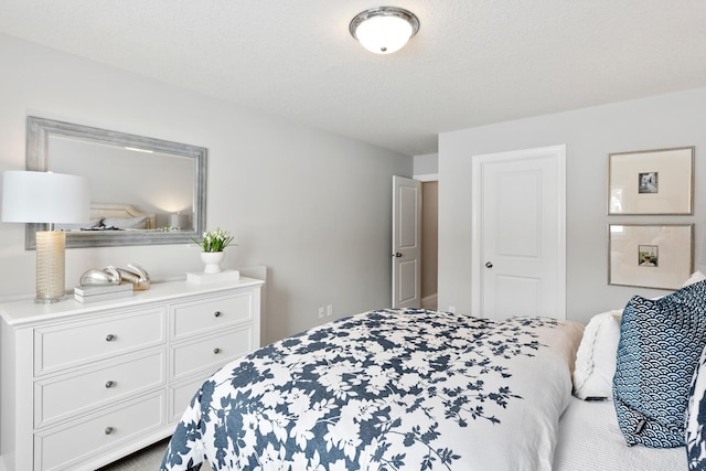 bedroom featuring a textured ceiling