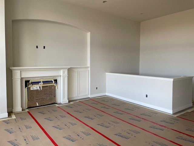 unfurnished living room featuring a fireplace