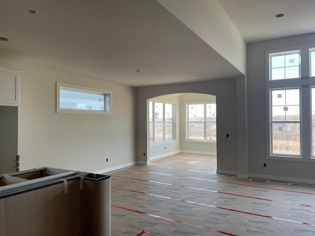 unfurnished living room with a textured ceiling